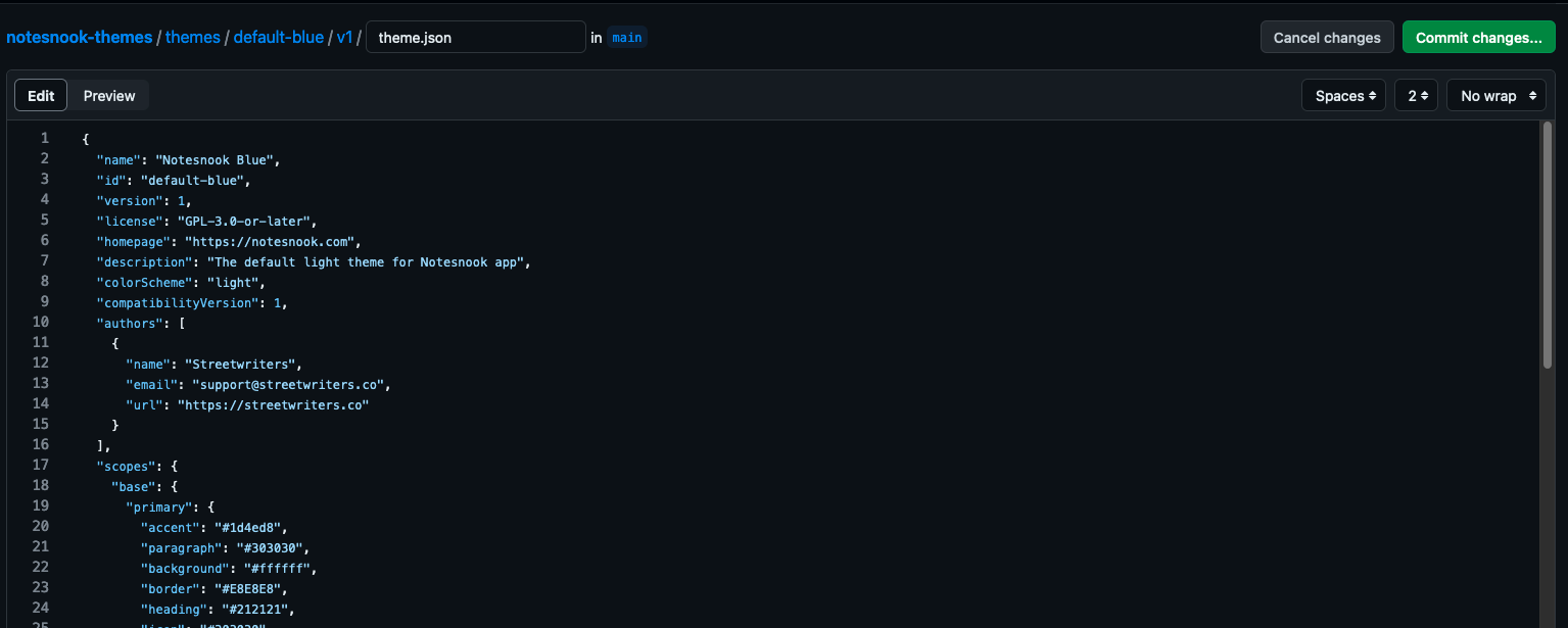 The theme JSON pasted into the new file, with the Commit changes button